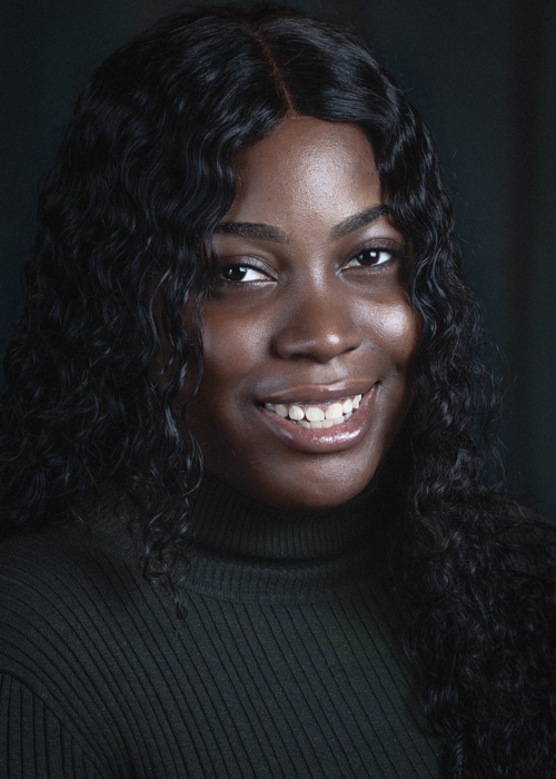 Rochelle did her own hair and makeup prior to the photo shoot. Her foundation matches her skin tone and she has kept her makeup very natural. This makes the image feel more like a business headshot.