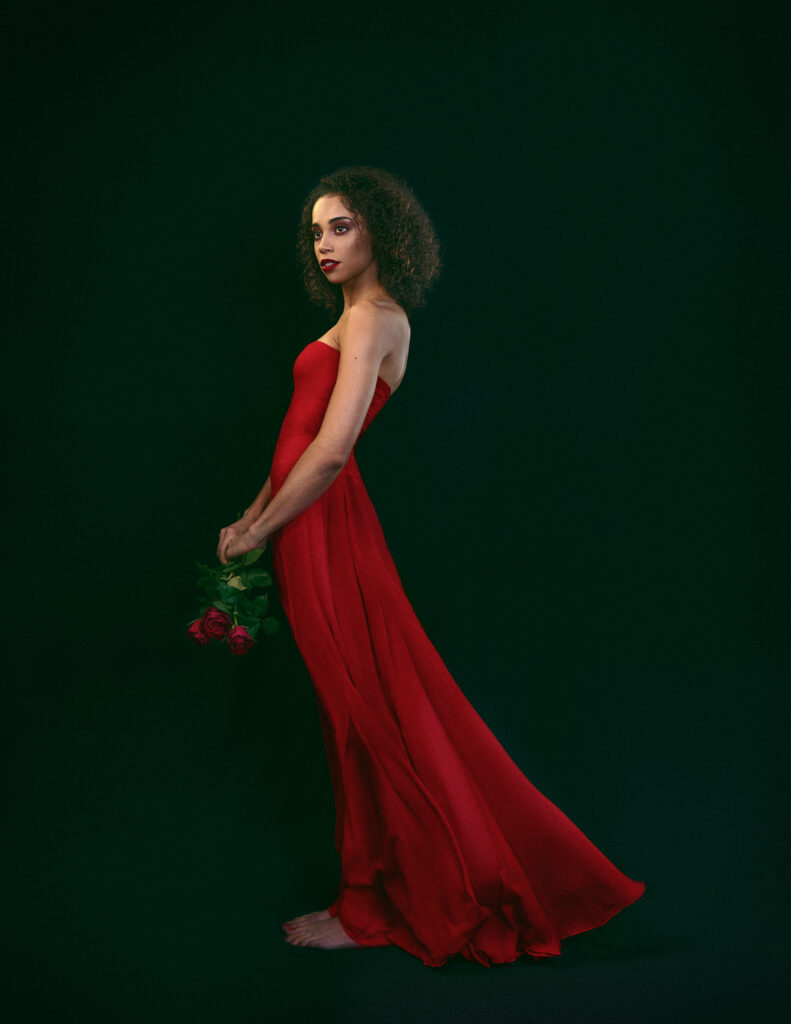 woman-in-red-holding-red-roses